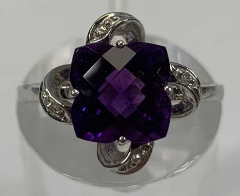 18CT WHITE GOLD RING, set with central square cut amethyst surrounded with diamond chips, size K-L, 2.8gmsProvenance: private