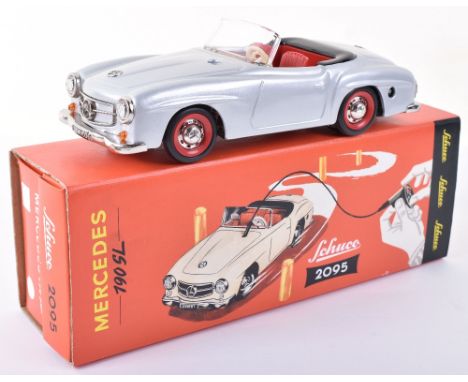 Schuco 2095 Mercedes 190SL, authentic replica, silver tin plate body, in mint boxed condition, with card sleeve.