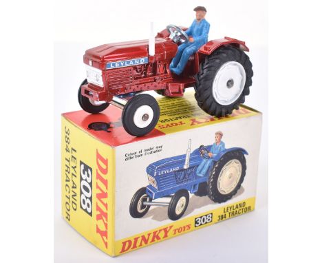 Dinky Toys 308 Leyland 384 Tractor, metallic red body, blue plastic driver, white plastic front wheel hubs, white metal rear 