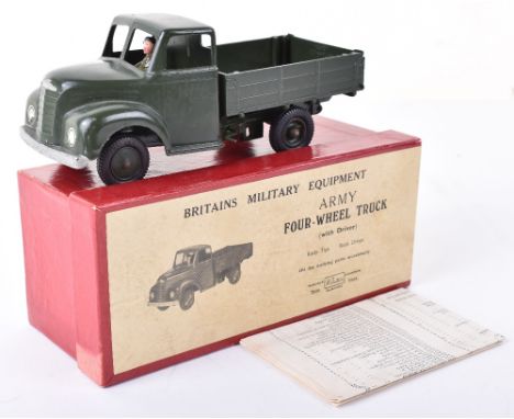 Britains boxed 1334 Army Four-wheel tipping truck, finished in Army green with driver and black plastic tyres, in picture lid