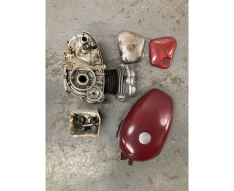 A Royal Enfield petrol tanktogether with a believed Royal Enfield engine numbered 11589G and other sundry items, completeness