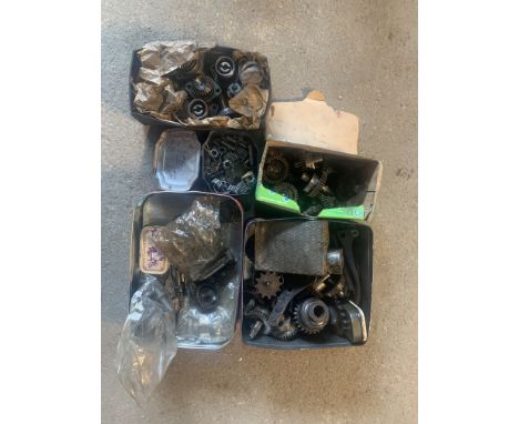 A selection of believed Velocette OHC bevel drive gearstogether with believed Velocette oil pump gears and sundry engine comp