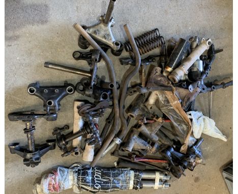 A selection of fork yokestogether with a variety of fork parts (some Norton), rear stands and assorted cycle part components,