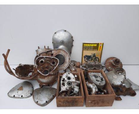 A quantity of believed Triumph partsincluding a 5TA engine casing (numbered H8617), cylinder heads, clutch parts, engine casi