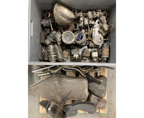 An Autojumblers Lotcomprising magnetos, dynamos, carburettors, acetylene lamps and generators, saddles, toolbox, handlebars a