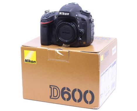 Nikon: A boxed Nikon D600 camera body, serial number 8007559, within original box, with manual, battery and charger, and stra