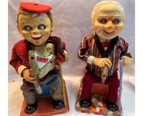 Tinplate: A pair of vintage battery operated, McGregor by Nomura, Japan; together with a clockwork monkey, remote control dog