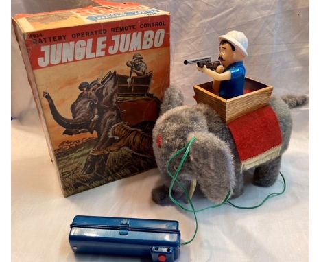Tinplate: A vintage battery operated, Jungle Jumbo, in part working condition, (Elephant walks but Hunter doesn’t move), orig