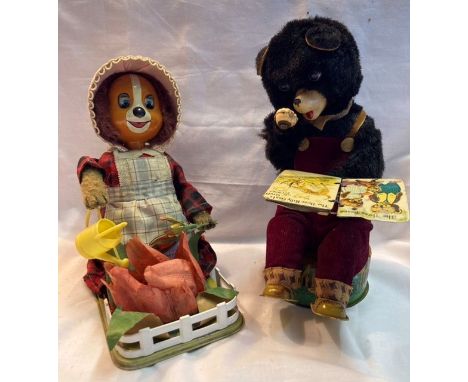 Tinplate: A rare vintage Lady Dog Gardener, battery operated, Made in Japan for Cragstan, some battery box damage but working