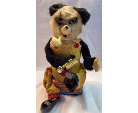 Tinplate: A vintage battery operated Shoe Shine Bear, Panda, Made in Japan by Alps, good working condition.