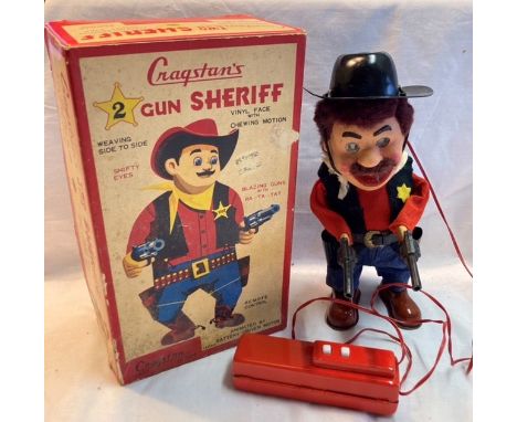 Tinplate: A vintage battery operated, remote control, Two Gun Sheriff, Made in Japan by Yonezawa for Cragstan, excellent work