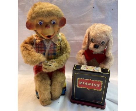 Tinplate: A vintage battery operated Dog Pianist, Nomura, Japan; and Bubble Blowing Monkey, (no bubble container or battery b