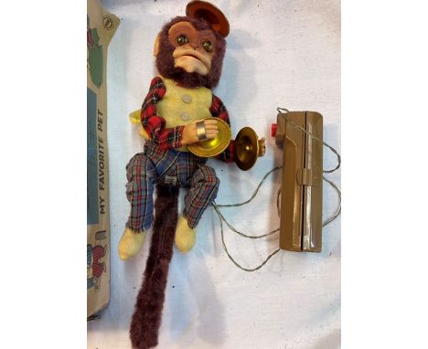 Tinplate: A vintage battery operated, remote control, Friendly Jocko Monkey, Made in Japan by Alps, excellent working conditi