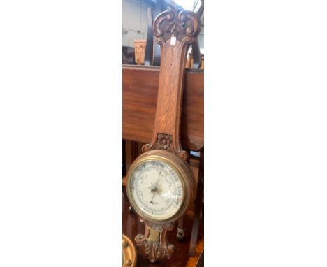 An oak banjo barometer by M.H Tilley &amp; Son Dorchester, 84cmH 