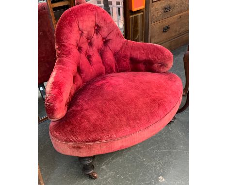 A 19th century button upholstered corner armchair, 83cmW on turned legs and casters 