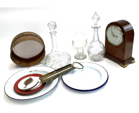 A cut glass ships decanter and one other; together with a jam thermometer and four enamel plates; and mantel clock 
