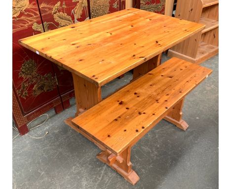 A pine kitchen table on refectory style base, 107x68x74cm; together with a matching bench, 106cmL 