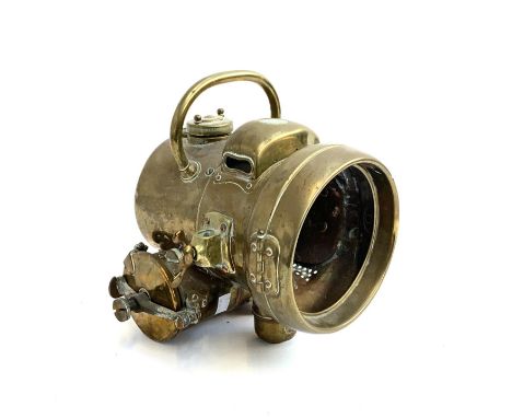 A Powell &amp; Hanmer brass acetylene automobile lamp, with loop carrying handle and original removable burner reservoir, 23c