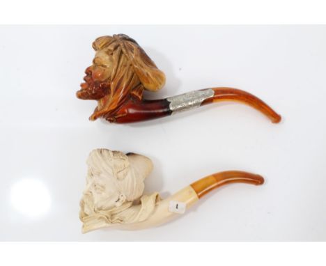 Two cased late 19th / early 20th century meerschaum pipes - both carved with Turkish heads, the first with silver mounted col