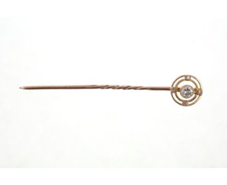 Edwardian diamond stick pin with a central brilliant cut diamond within concentric gold circles CONDITION REPORT Diamond esti