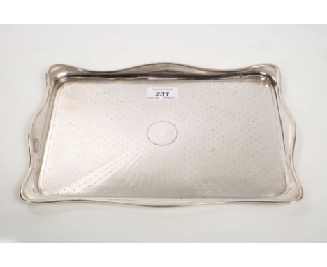 Early 1920s silver dressing table tray of rectangular form, with shaped border, engine-turned decoration and vacant central c