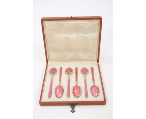 Set of six late 19th / early 20th century Imperial Russian silver gilt spoons with pink guilloche enamel decoration, in a fit