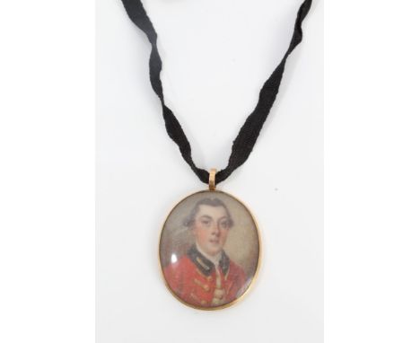 English School (mid-18th century), portrait miniature on ivory of a young military officer, oval, 3.5cm x 3cm, in glazed gilt