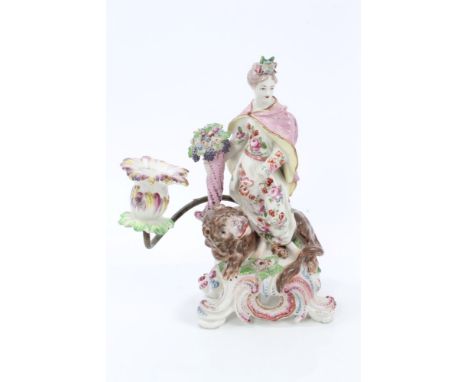 18th century Bow porcelain candlestick in the form of Ceres, emblematic of Mother Earth, holding a cornucopia with a lion at 