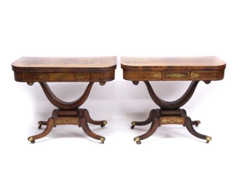 Rare pair of Regency rosewood, grained rosewood and brass inlaid card tables, each of D-shaped form, with fold-over top enclo