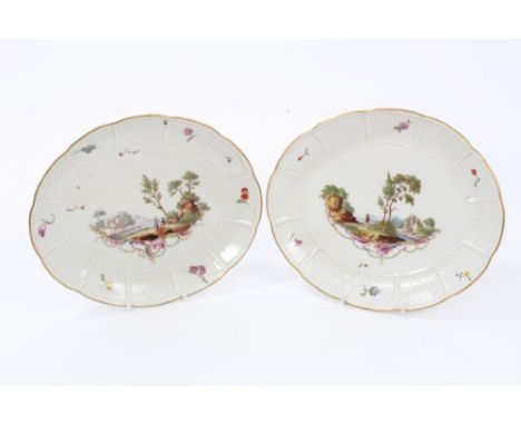Pair 18th century Ludwigsburg oval dishes with polychrome painted Meissen-style figure in landscape decoration within basket 