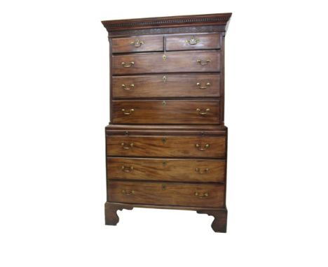 George III mahogany chest on chest, the upper section with dentil cornice and two short over three long drawers, the base wit