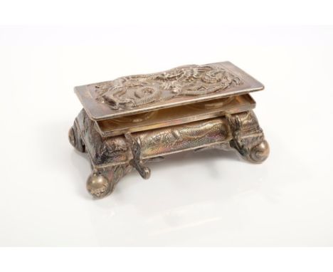 Late 19th / early 20th century Chinese silver double inkwell in the form of a rectangular casket with embossed dragon decorat