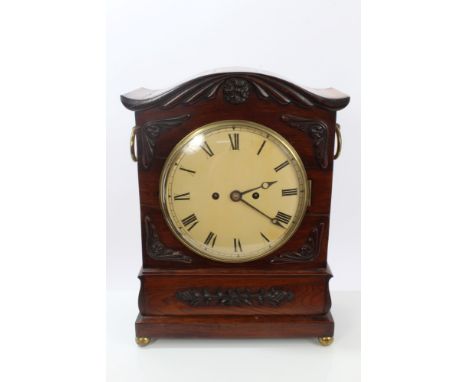 Regency period bracket clock with eight day twin fusee movement striking on a bell and circular dial with Roman numerals, in 