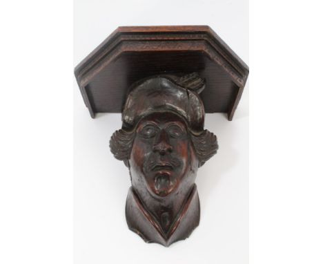 19th century or earlier carved oak figural wall bracket carved in the form of a gentleman with moustache and brimmed hat, wit