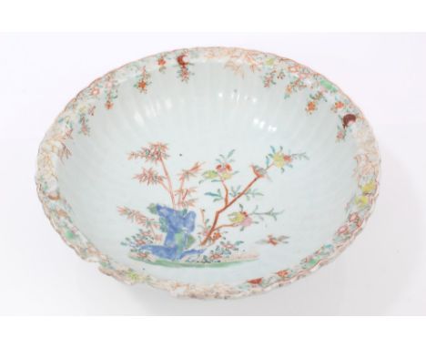 Mid-18th century Chinese export fluted basin with polychrome painted birds in flowering trees and rocks within fruiting borde