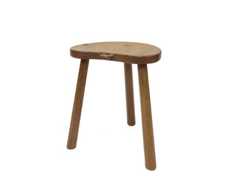 Robert 'Mouseman' Thompson of Kilburn, carved oak stool, the saddle seat with signature mouse to front edge, on three octagon