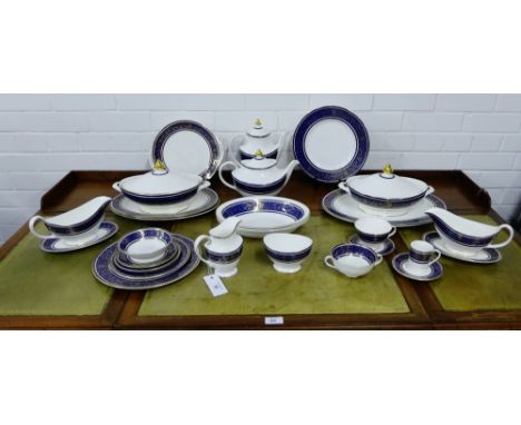 An extensive Royal Doulton Imperial Blue pattern dinner service for a twelve place setting comprising dinner plates, medium p