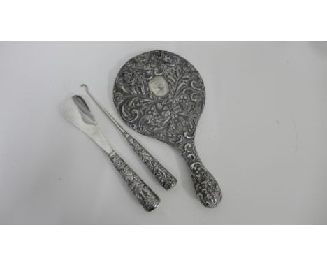 Late 19th / early 20th century Chinese / Canton silver shoe horn and button hook set each decorated in relief showing  figure