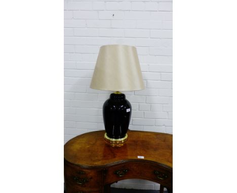 A black baluster table lamp base with gilt base and cappucino coloured shade 