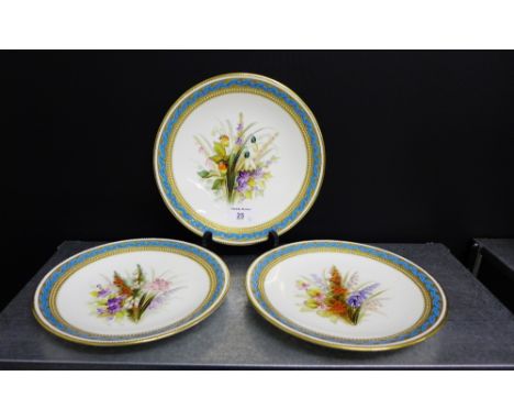 A group of three Royal Worcester porcelain plates, each hand painted with summer flowers to the centre within a jewelled and 