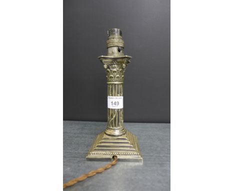 An Epns electric table lamp base, in the form of a corinthian column, 22cm high 