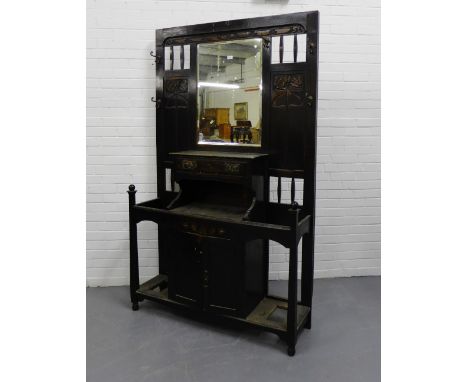 Oak hall stand, with rectangular mirror back flanked by carved Art Nouveau motifs, above a single drawer, over a pair of cent