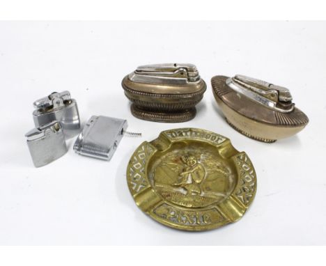 A collection of vintage table lighters and a brass ashtray 