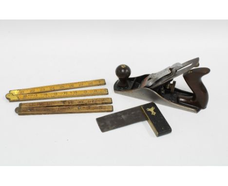 Box containing working tools to include a set square, ruler and a vintage Stanley No.4 plane. 