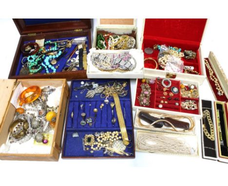 A large collection of vintage and later costume jewellery contained over several jewellery boxes (a lot) 