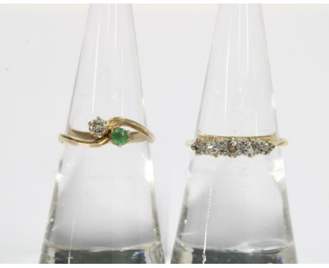 9ct gold diamond and emerald crossover ring, London 1980 and an early 20th century five stone diamond gold and platinum ring 