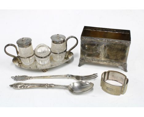 An Edwardian silver stand with three glass and silver mounted condiments Sheffield 1904 together with a William Hutton &amp; 