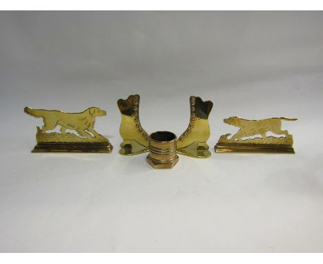 Five pieces of brass including two dogs, a pair of boots and a piece of Trench Art 