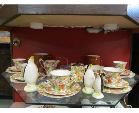 An Art Deco L. Kent Ltd part tea set, milk jug, sugar bowl, cup, saucers etc, green and orange foliate pattern, three graduat
