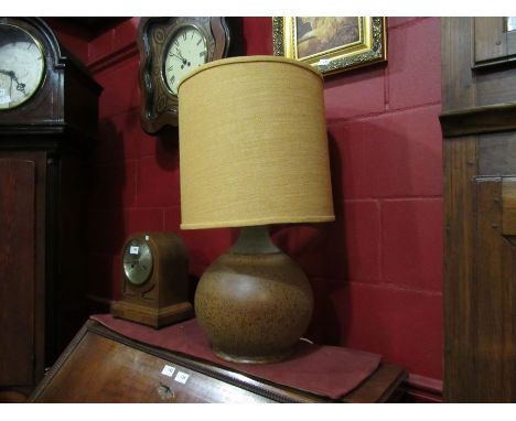 A 1960's pottery table lamp base with textile shade